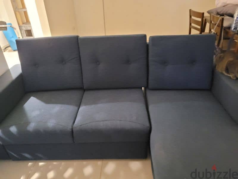Sofa with some scratches and one button missing. 4