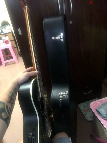 hard case guitar for sale 40 omr with free guitar 1