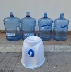 Four empty water bottles and coler. anybody interest please contract me