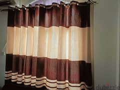 12 good quality curtains with rods for sale.