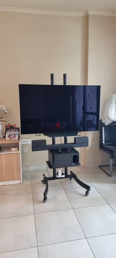 Smart TV 55 inch with wheeled stand with surround system