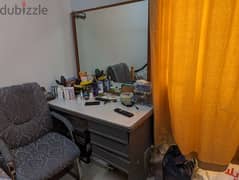 Office desk with large mirror