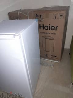 brand haier new box pack fridge only door small dent . no use
