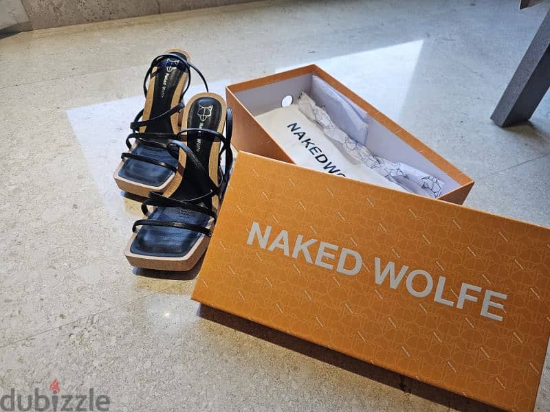 REDUCED PRICE! GREAT price.  New Pair of Naked Wolf black high heels. 7