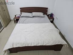 king-size bed with two side tables 0