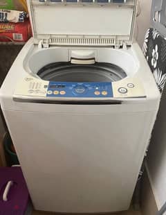 OMidea Washing  10 Kg for sale in good condition +water dispenser