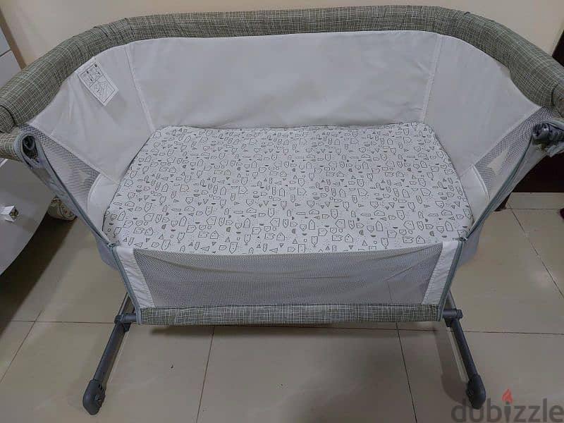 baby crib can be attached to bed 5