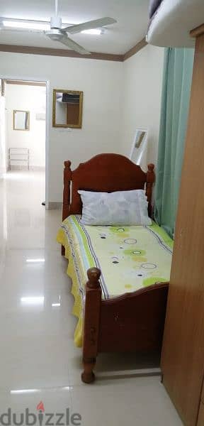 furnished bedroom with living room at alkhwier 3