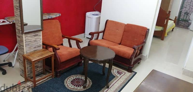 furnished bedroom with living room at alkhwier 4