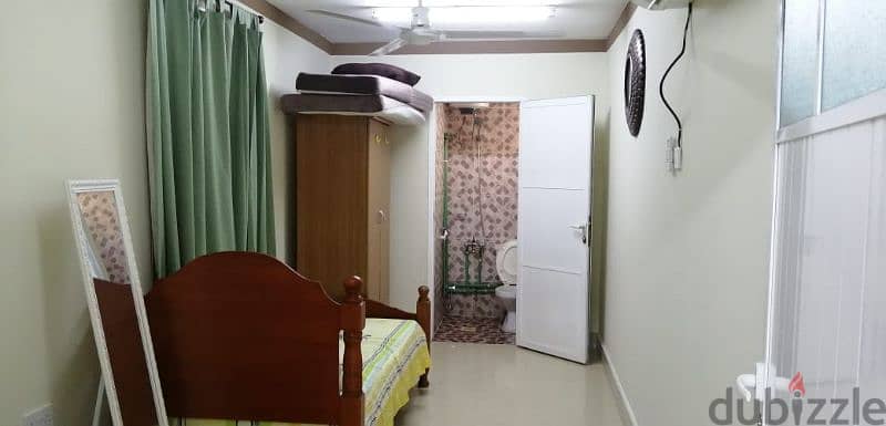 furnished bedroom with living room at alkhwier 5