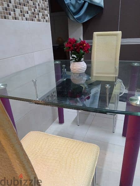 glass dinning table, 4 door storage cupboard ,tv stand 1