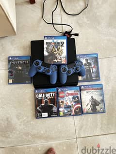 PS4 SLIM 1 TB WITH 2 CONTROLLERS AND ALL GAMES INCLUDED.