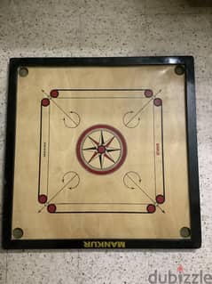 Carrom board with coins