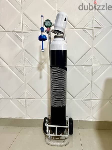 Oxygen cylinder (full) it’s new and with stand 1