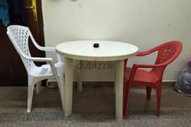 table with 2 no's plastic chair 0