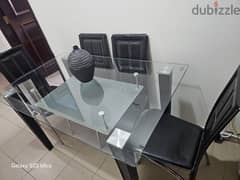 Glass top dinning table with 4 chairs