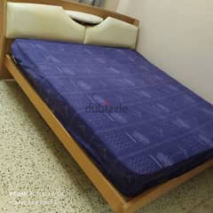 wooden cot and bed