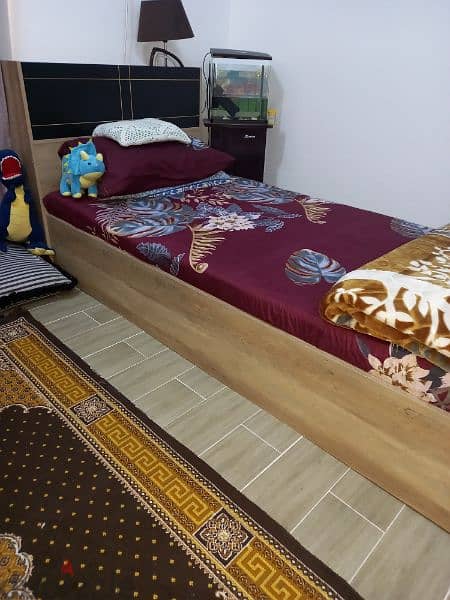 single wooden bed 1