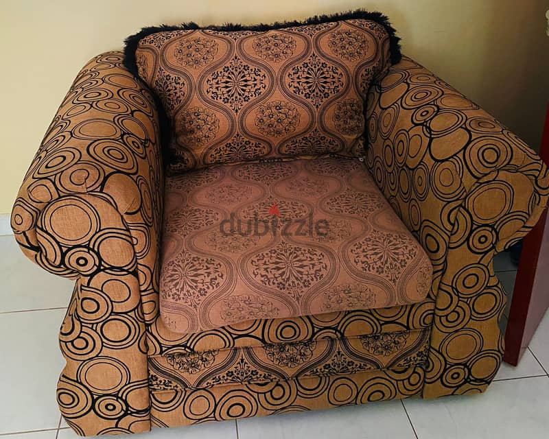 A single-seater sofa in good condition 0