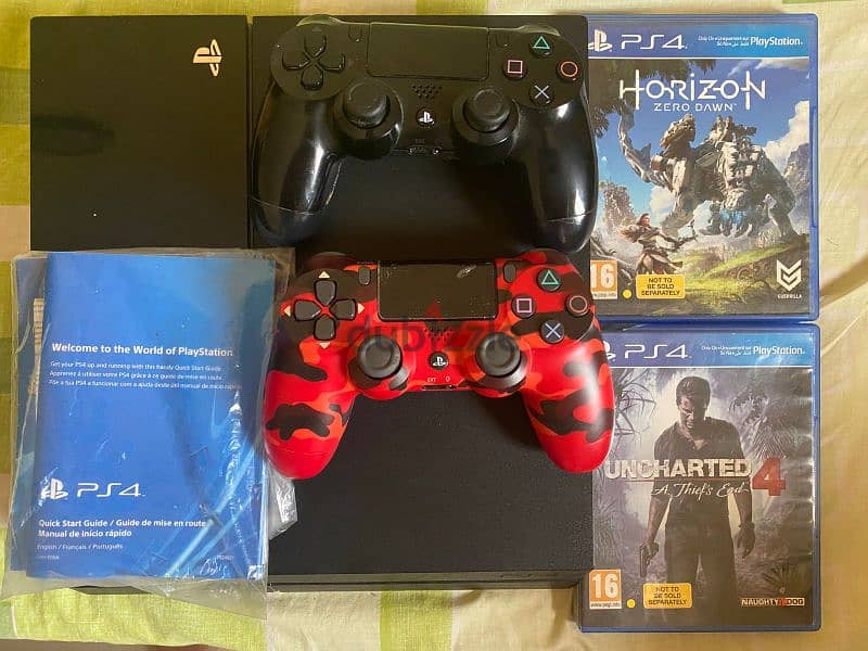 PS4 1TB with 2 controllers and 2 games 0