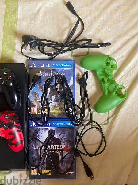 PS4 1TB with 2 controllers and 2 games 1