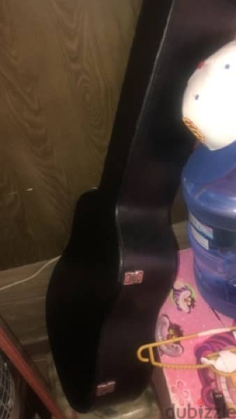 hard case guitar for sale 40 omr with free guitar 2