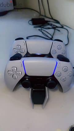 a new PS5 with 2 controller and a charging dock