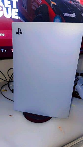 a new PS5 with 2 controller and a charging dock 2