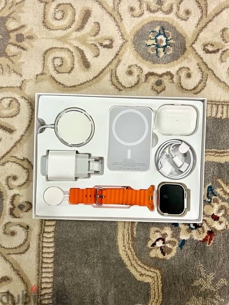 a new watch with earbuds and power bank in great condition 1