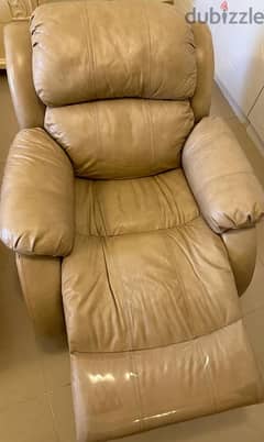 Beige colored leather recliner.