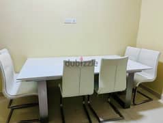 Home centre Dining table expandable with 6 leath chairs urgent selling