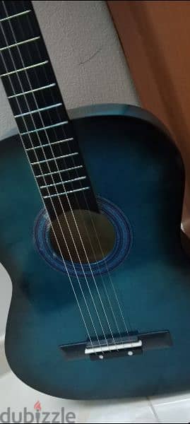 medium size acoustic guitar in blue color 2
