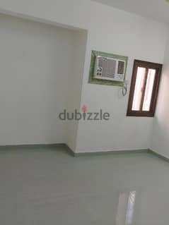 a room for rent in an apartment in al khuwair.