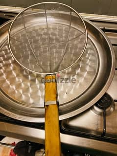 large sieve and 2 large plates
