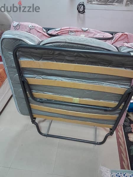 foldable bed in very good condition and bike 1