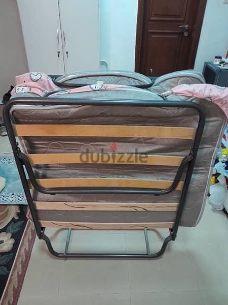 foldable bed in very good condition and bike 2