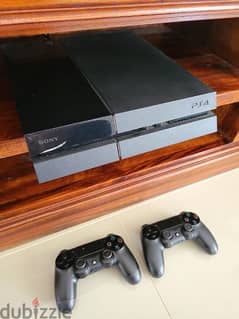 playstation 4 (ps4) with 2 controllers