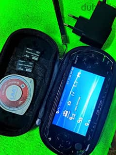 PSP with charger memory and bag and game disk