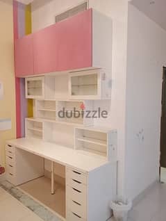 study table, chair, shelves, cupboards