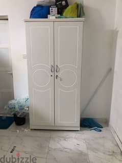 Two wooden single bed and Cupboard