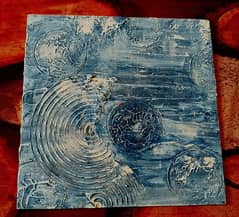 Textured Abstract painting with circular motifs in blue and white