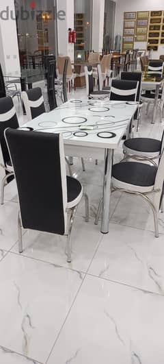 8 months old dining table & chairs. Purchase prcie 95omr sell price 50