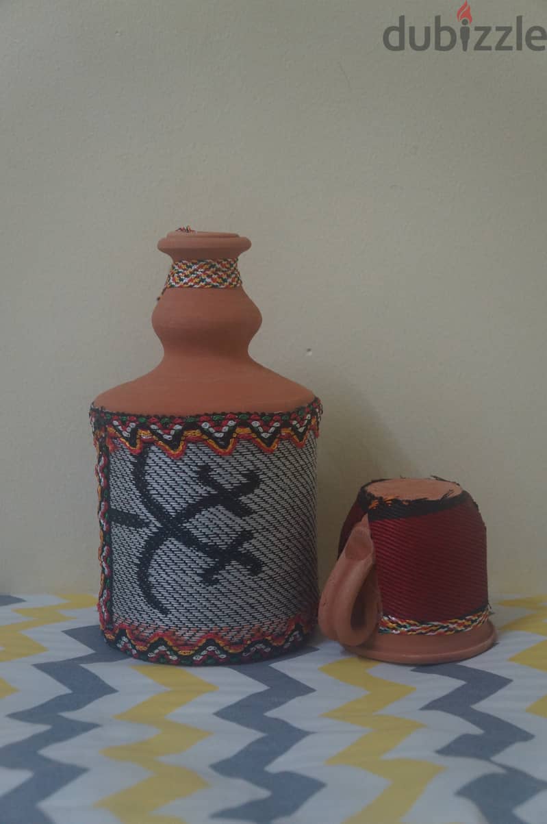 Pottery jar with cup 1