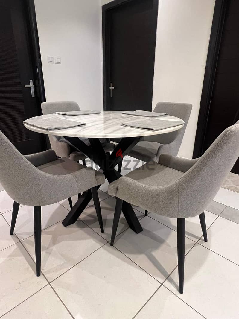 Like New Four Fabric Chairs and Circle Granite Table 0