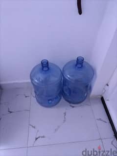 Three empty water bottle with manual feed pump