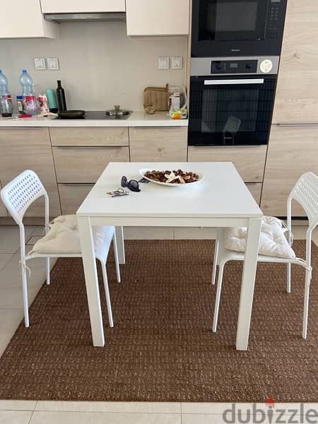 Modern dinning table with two chairs and cushions- perfectly new 0