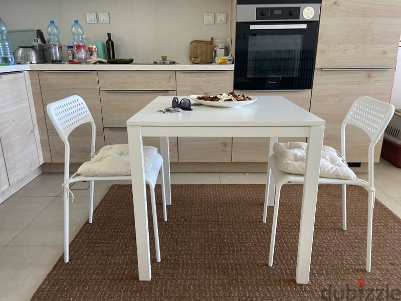 Modern dinning table with two chairs and cushions- perfectly new 1