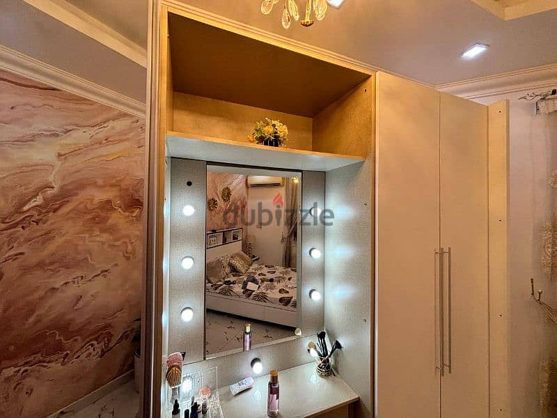 white and beige wadrobe with dressing table in middle 5