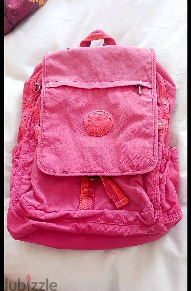 Kipling's Seoul Up Backpack in Pink. 1