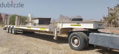 Low bed trailer extra long with Mercedes unit